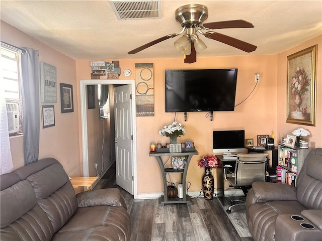 4040 Velie St, New Orleans, LA 70126 - living room with dark wood finished floors, ceiling fan, and a desk