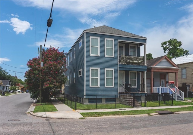 414345 Ulloa St, New Orleans, LA 70119 - townhome / multi-family property with a porch and a fenced front yard