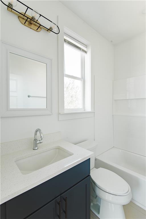 414345 Ulloa St, New Orleans, LA 70119 - full bathroom featuring vanity and bathing tub / shower combination