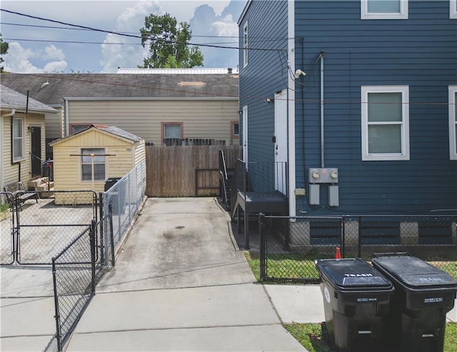 414345 Ulloa St, New Orleans, LA 70119 - view of property exterior featuring a gate and a storage shed