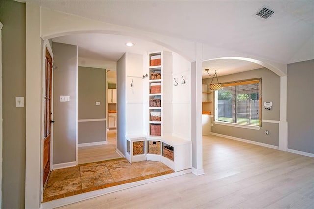 808 N Pearl St, Slidell, LA 70461 - hall with wood finished floors, arched walkways, and recessed lighting