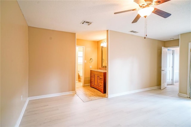 808 N Pearl St, Slidell, LA 70461 - spare room with ceiling fan, a textured ceiling, and light wood finished floors