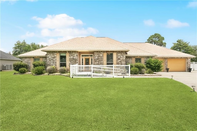 804 S Hawthorn Ct, Slidell, LA 70458 - view of front of house featuring a porch, an attached garage, a front lawn, concrete driveway, and stone siding
