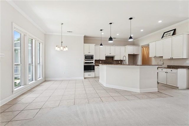 804 S Hawthorn Ct, Slidell, LA 70458 - kitchen featuring stainless steel appliances, ornamental molding, under cabinet range hood, backsplash, and dark countertops