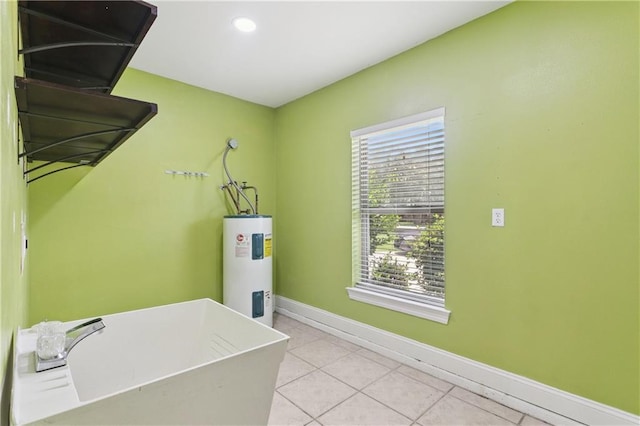 804 S Hawthorn Ct, Slidell, LA 70458 - laundry room with water heater, light tile patterned floors, and recessed lighting