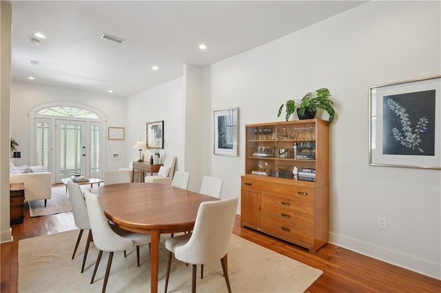 208 S Scott St, New Orleans, LA 70119 - dining space featuring wood finished floors and recessed lighting