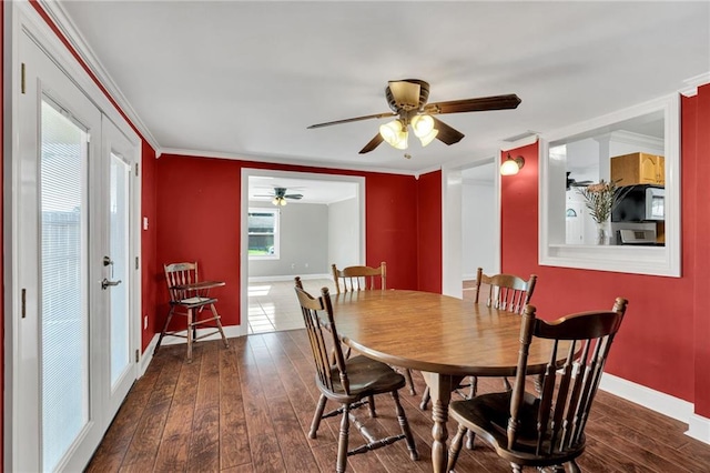 2412 Green Acres Rd, Metairie, LA 70003 - dining room with a ceiling fan, dark wood-type flooring, and crown molding