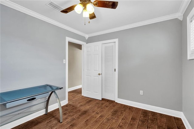 2412 Green Acres Rd, Metairie, LA 70003 - unfurnished bedroom with crown molding, wood finished floors, ceiling fan, and a closet