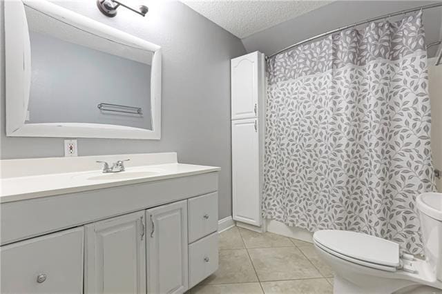 5080 Betty Mae St, Lafitte, LA 70067 - bathroom featuring vanity, a textured ceiling, tile patterned flooring, and a shower with curtain