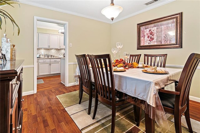 2018 Saint Nick Dr, New Orleans, LA 70131 - dining room with wood finished floors and crown molding