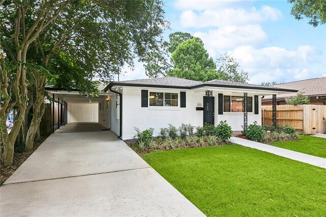 1221 Brockenbraugh Ct, Metairie, LA 70005 - ranch-style home featuring driveway, an attached carport, and brick siding