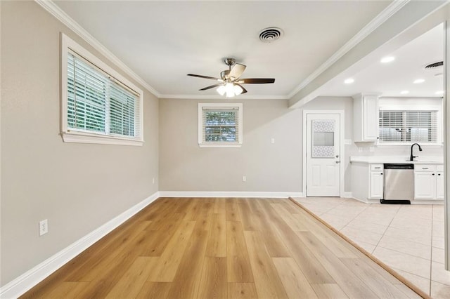 1221 Brockenbraugh Ct, Metairie, LA 70005 - unfurnished living room featuring ceiling fan, crown molding, light wood-style floors, and recessed lighting