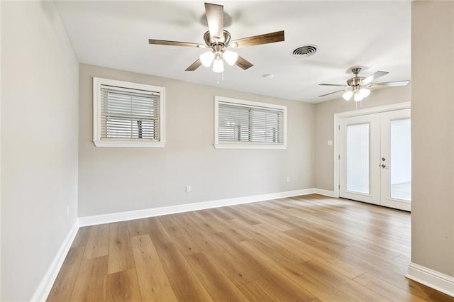 1221 Brockenbraugh Ct, Metairie, LA 70005 - spare room featuring a ceiling fan, light wood-type flooring, and french doors