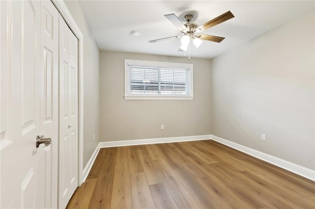 1221 Brockenbraugh Ct, Metairie, LA 70005 - unfurnished bedroom featuring a closet, light wood-style flooring, and ceiling fan
