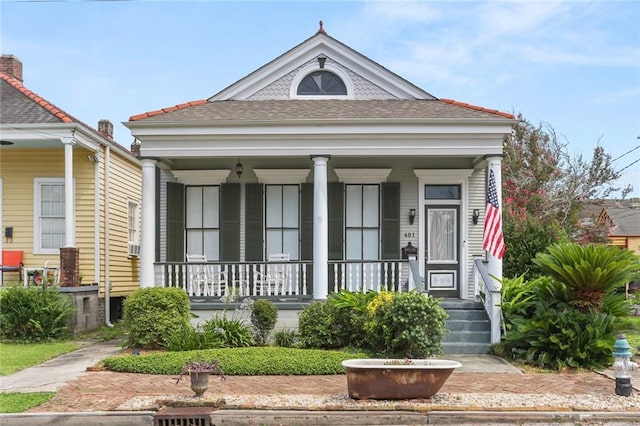 401 Pelican Ave, New Orleans, LA 70114 - view of front facade with covered porch and a shingled roof