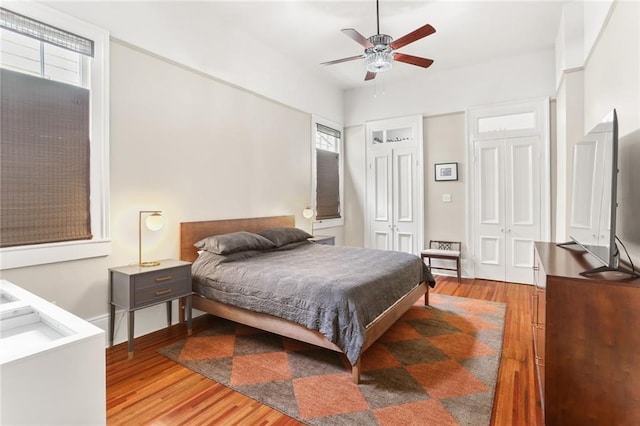 401 Pelican Ave, New Orleans, LA 70114 - bedroom featuring light wood-type flooring, multiple windows, and ceiling fan