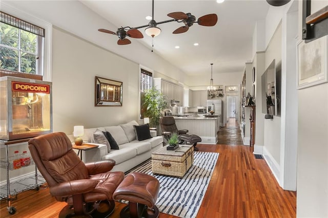 401 Pelican Ave, New Orleans, LA 70114 - living room featuring ceiling fan, recessed lighting, dark wood-style flooring, and a chandelier