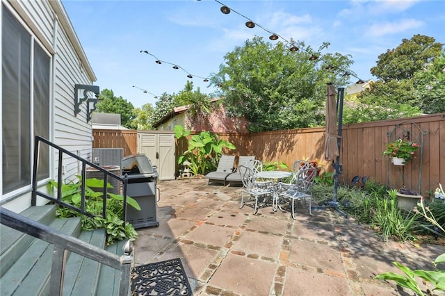 401 Pelican Ave, New Orleans, LA 70114 - fenced backyard featuring a patio area, outdoor dining space, and grilling area