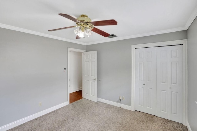 891 Cross Gates Blvd, Slidell, LA 70461 - unfurnished bedroom with carpet flooring, ornamental molding, a closet, and a ceiling fan