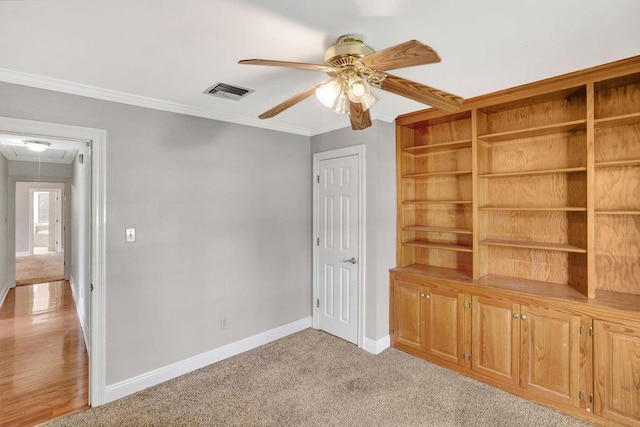 891 Cross Gates Blvd, Slidell, LA 70461 - unfurnished bedroom featuring attic access, ornamental molding, light colored carpet, and a ceiling fan