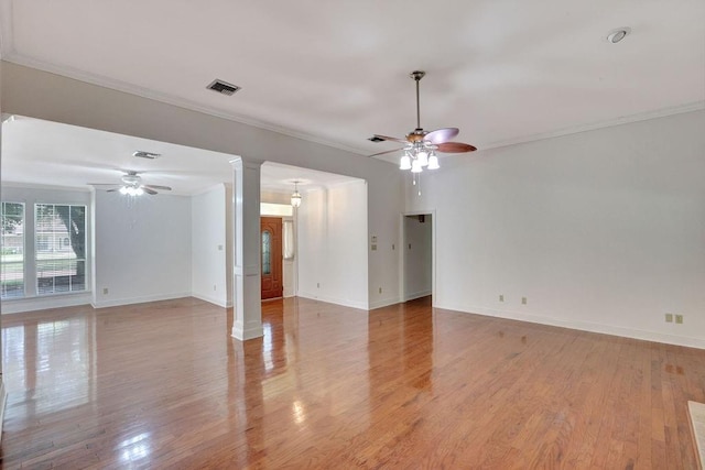 891 Cross Gates Blvd, Slidell, LA 70461 - empty room featuring ceiling fan, ornate columns, crown molding, and light wood-style flooring