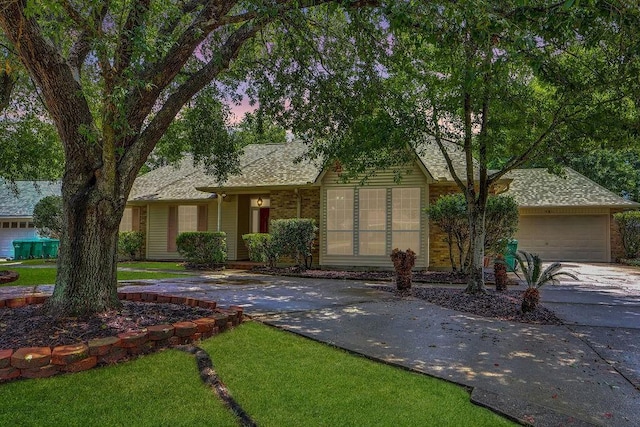 891 Cross Gates Blvd, Slidell, LA 70461 - single story home featuring concrete driveway, a front lawn, roof with shingles, and a garage