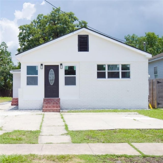 4235 Alfred St, New Orleans, LA 70122 - bungalow-style home with entry steps and brick siding