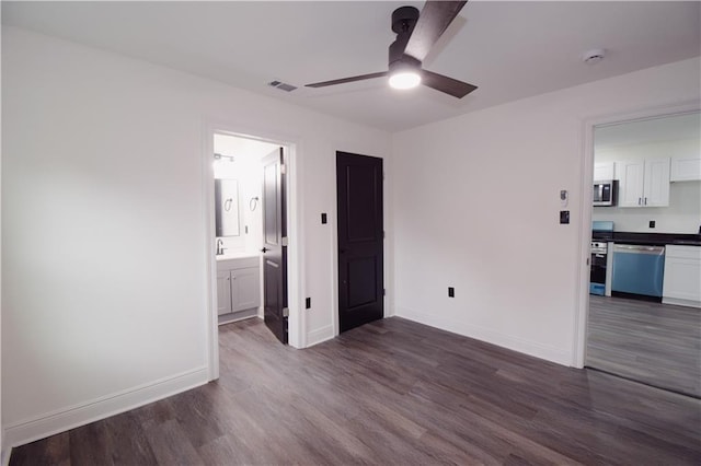 4235 Alfred St, New Orleans, LA 70122 - empty room with ceiling fan, dark wood finished floors, and a smoke detector