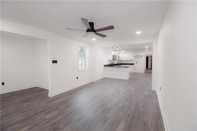4235 Alfred St, New Orleans, LA 70122 - unfurnished living room featuring dark wood finished floors, a ceiling fan, and recessed lighting