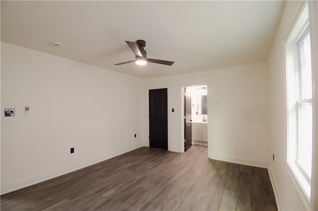 4235 Alfred St, New Orleans, LA 70122 - spare room featuring dark wood-type flooring, plenty of natural light, and a ceiling fan