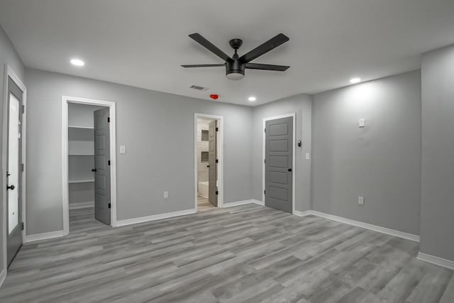 206 Fairfax Pl, New Orleans, LA 70131 - unfurnished bedroom featuring recessed lighting, a walk in closet, wood finished floors, a ceiling fan, and connected bathroom