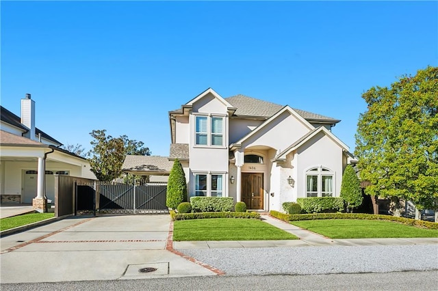1456 Cherokee Ave, Metairie, LA 70005 - view of front facade with concrete driveway, stucco siding, and a gate