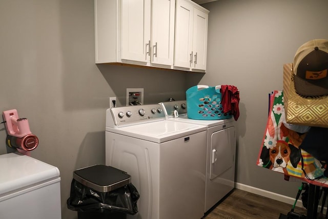 480 Woody Rd Unit 0, Jayess, MS 39641 - washroom featuring washer and clothes dryer, cabinet space, and dark wood-style flooring