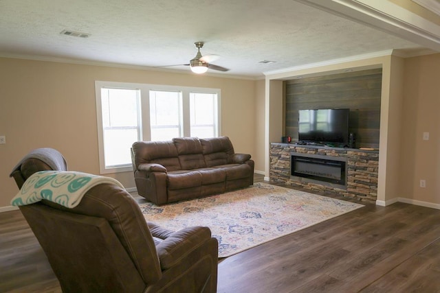 480 Woody Rd Unit 0, Jayess, MS 39641 - living room featuring a ceiling fan, dark wood finished floors, a fireplace, and crown molding