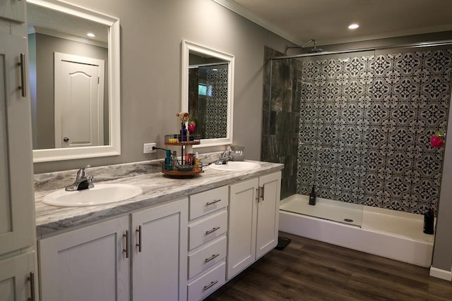 480 Woody Rd Unit 0, Jayess, MS 39641 - full bathroom with double vanity, crown molding, wood finished floors, and recessed lighting
