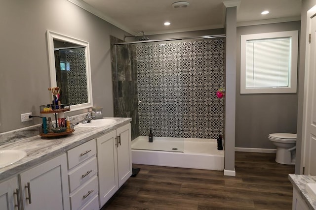 480 Woody Rd Unit 0, Jayess, MS 39641 - bathroom featuring crown molding, tiled shower, double vanity, wood finished floors, and recessed lighting