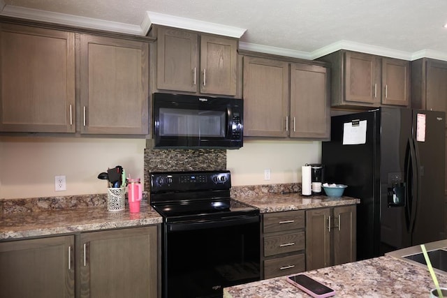 480 Woody Rd Unit 0, Jayess, MS 39641 - kitchen featuring black appliances, ornamental molding, light stone countertops, and dark brown cabinets