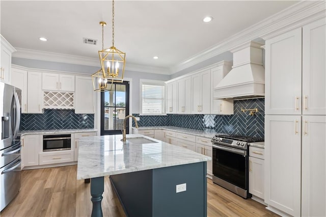 1316 Hickory Ave, Harahan, LA 70123 - kitchen with stainless steel appliances, custom exhaust hood, white cabinets, backsplash, and recessed lighting
