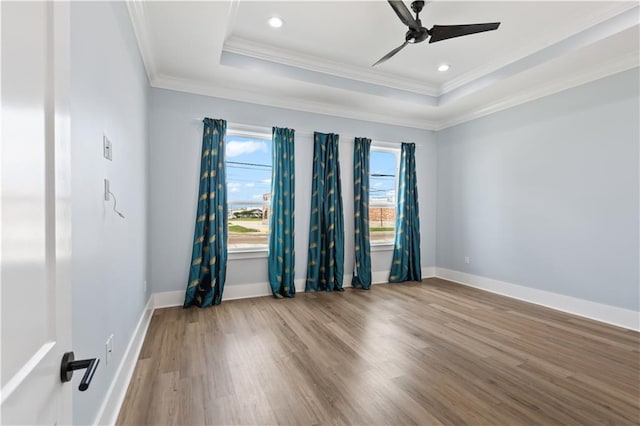 1316 Hickory Ave, Harahan, LA 70123 - empty room with a tray ceiling, ornamental molding, wood finished floors, a ceiling fan, and recessed lighting
