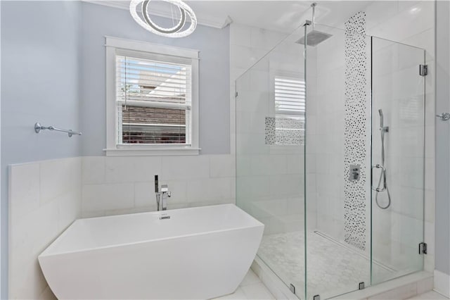1316 Hickory Ave, Harahan, LA 70123 - bathroom with a freestanding tub, a shower stall, and tile walls