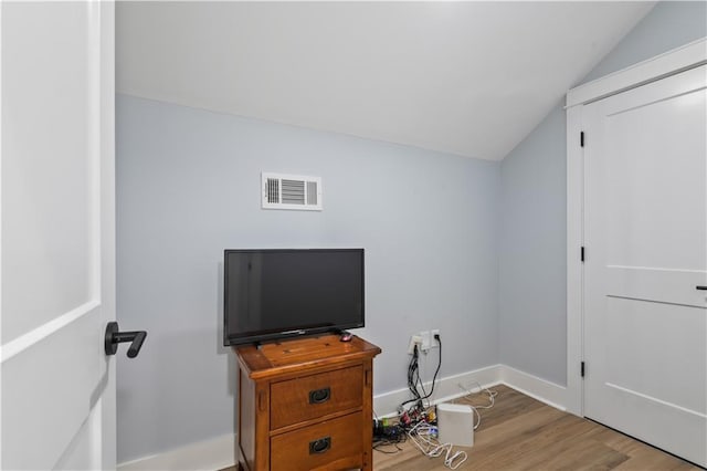 1316 Hickory Ave, Harahan, LA 70123 - bedroom featuring lofted ceiling and wood finished floors
