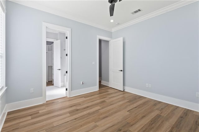 1316 Hickory Ave, Harahan, LA 70123 - unfurnished bedroom with ornamental molding, light wood-type flooring, recessed lighting, a spacious closet, and ceiling fan