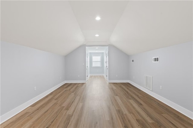 1316 Hickory Ave, Harahan, LA 70123 - additional living space with light wood-type flooring, vaulted ceiling, and recessed lighting