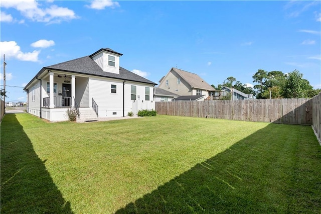 1316 Hickory Ave, Harahan, LA 70123 - back of property featuring ceiling fan, a fenced backyard, crawl space, a shingled roof, and covered porch