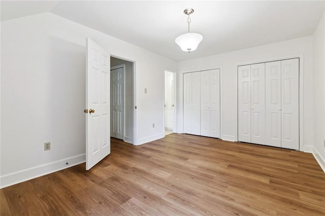 3523 Audubon Trce Unit 3523, Jefferson, LA 70121 - unfurnished bedroom with multiple closets and light wood-style flooring