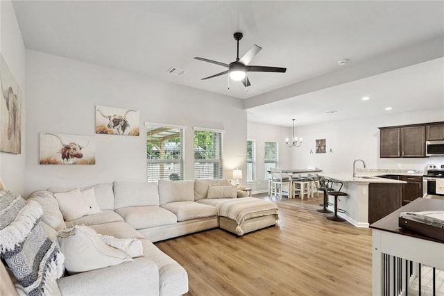 41763 Whisper Woods Rd, Ponchatoula, LA 70454 - living area featuring a chandelier, light wood-style flooring, a ceiling fan, and recessed lighting