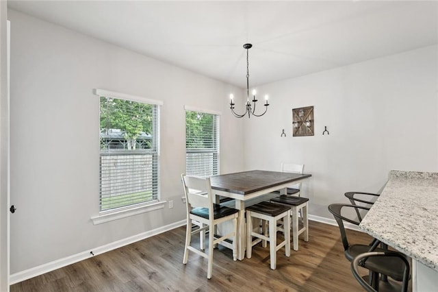 41763 Whisper Woods Rd, Ponchatoula, LA 70454 - dining space with a chandelier and wood finished floors