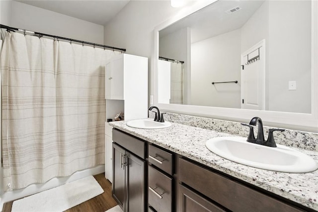 41763 Whisper Woods Rd, Ponchatoula, LA 70454 - full bathroom featuring wood finished floors and double vanity