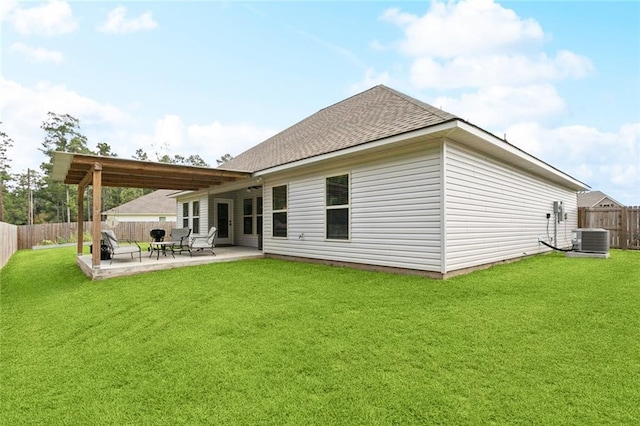 41763 Whisper Woods Rd, Ponchatoula, LA 70454 - back of house featuring a fenced backyard, a patio area, and roof with shingles