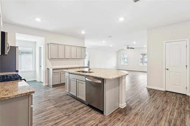 24359 Dawson Ct, Ponchatoula, LA 70454 - kitchen featuring appliances with stainless steel finishes, gray cabinetry, dark wood-style flooring, healthy amount of natural light, and recessed lighting